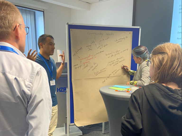 Participants discussing in front of a board.